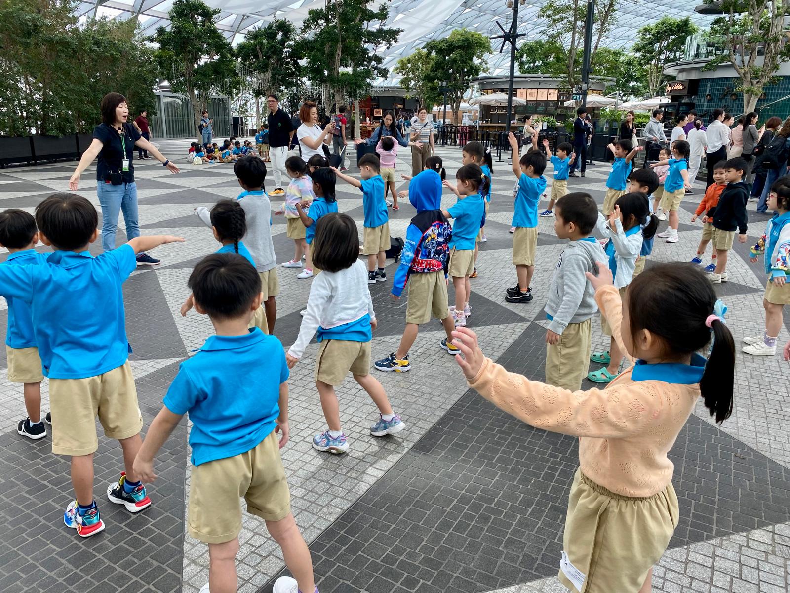 MK Alexandra students doing warm-up stretches